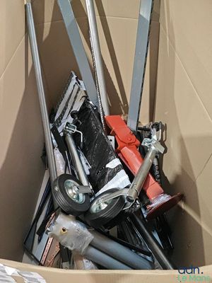 a cardboard box filled with assorted tools and tools