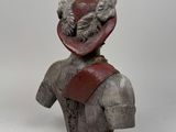 statue of a man with a hat on his head