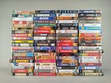 a lot of dvds stacked on top of each other