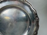 a silver plate that is sitting on a table