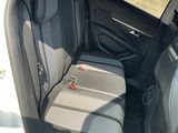 the back seats of a car are empty and the passenger seat is empty