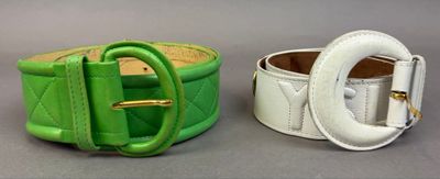 two belts that are sitting next to each other on a table