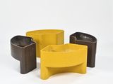 three yellow and brown planters sitting next to each other on a white surface