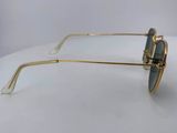 a close up of a pair of sunglasses on a white surface