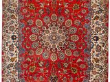 a red and blue rug with a medallion design on it