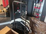 a cardboard box that is sitting on the floor next to a luggage cart