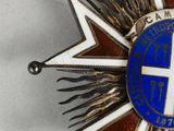 an image of a star shaped badge with a cross on top of it