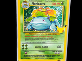 an image of a pokemon card with a picture of a lizard