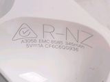 a close up of a white toilet with a sticker on it