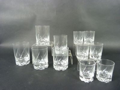 a lot of glasses that are sitting on a table