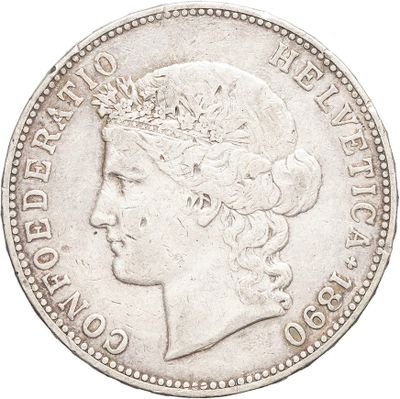 a close up of a coin with a woman ' s head on it