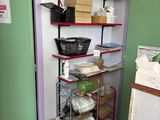 a room that has a shelf with many items on it