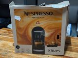 a box of nespresso coffee on a wooden table