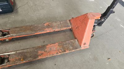 a picture of a forklift sitting in a garage