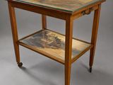an image of a small table with a painting on it