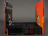 three books are stacked on top of each other on a table