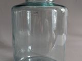 a glass jar with a lid on a table