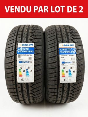 a pair of tires on a white background with a red label