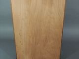 a small wooden cabinet with a door on the side of it