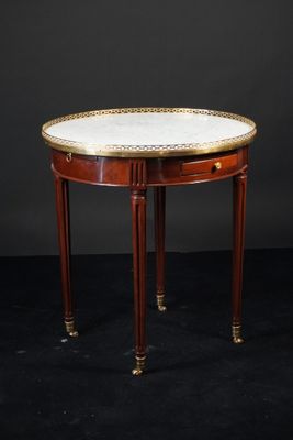 une image représentant une petite table avec un plateau en marbre sur fond noir