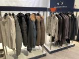 a display of coats and jackets on display in a store