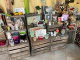 many wooden crates with pictures and other items on them