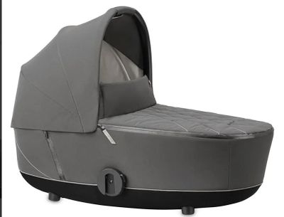 an image of a baby stroller with a cover on it