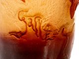 a close up of a glass with a liquid inside of it