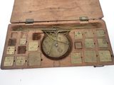 a wooden case with a clock inside of it