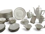 many different types of dishes and cups on this table