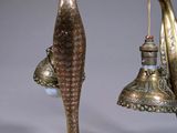 pair of antique brass peacocks with bells and bells hanging from them
