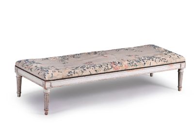 a white bench with a floral upholstered seat