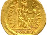 an image of a gold coin with an image of a woman on it