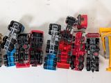 a lot of toy cars that are lined up together