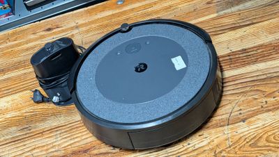 an image of a robot vacuum sitting on top of a wooden floor