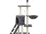 a cat tree with a cat toy and a bowl on top of it