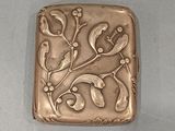 an image of a metal object with a flower design on it