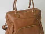 tan leather handbag with zippers and gold hardwares