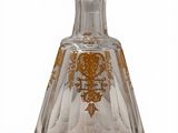 crystal decanter with gold decoration on a white background