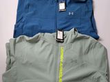 two men ' s jackets are sitting on top of each other