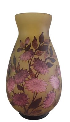 purple and yellow vase with flowers on it on a white background