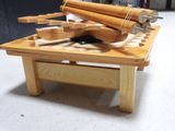 a wooden table with tools on it in a workshop