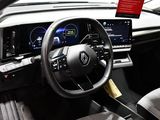 the interior of a car with a steering wheel and dashboard