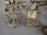 a lot of silver figurines that are on a table