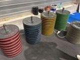 many different colored spools sitting on a table