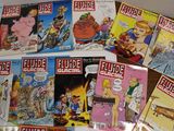 a lot of comic books on the table together