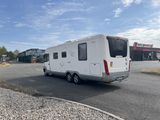 a white rv parked on the side of the road