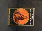 an orange and black box with a picture of a dragon on it