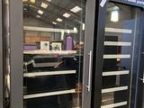 two glass doors that are open in a store