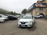 a white car that is parked in front of a building